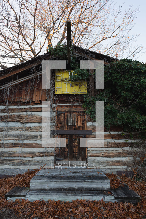 Old cabin with neon sign