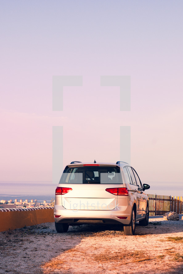 A car parked at the top of a viewpoint 