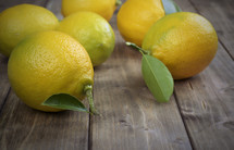 Lemons on a wood board table.