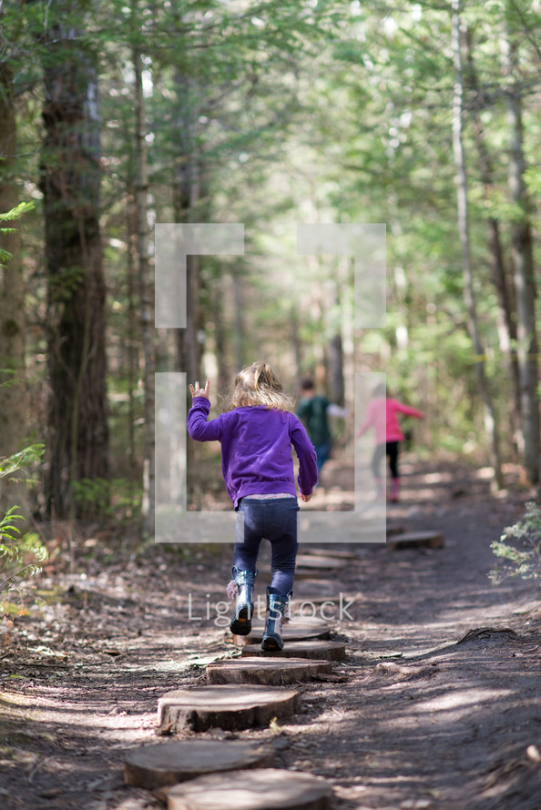 children exploring a nature trail 