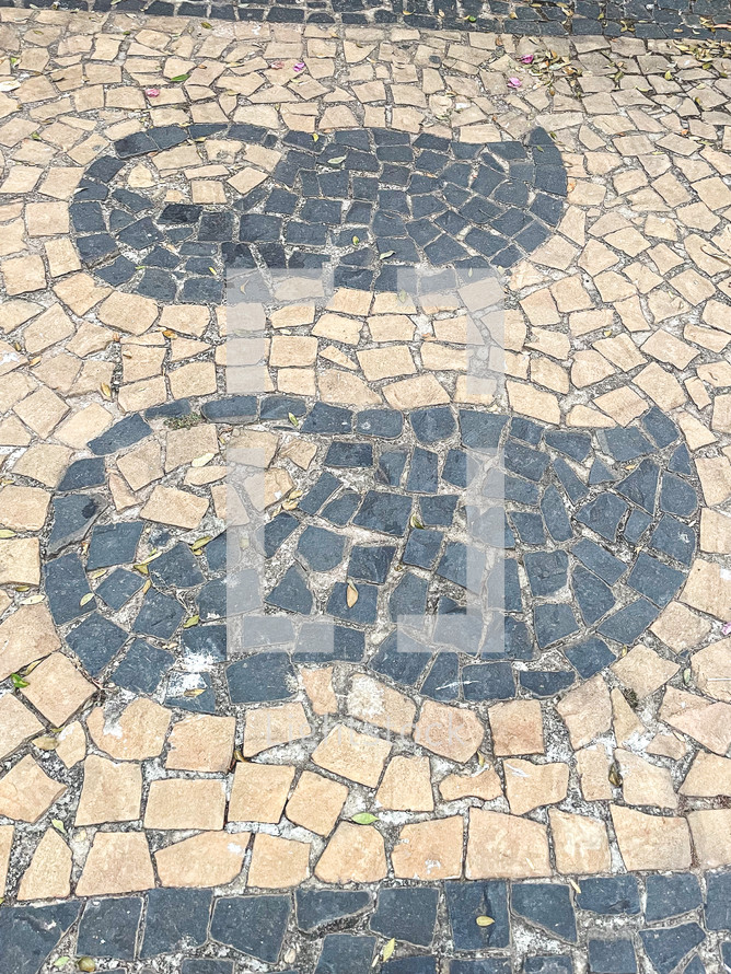 Paving stones with shapes of clogs, Typical Dutch wooden shoes. Holambra, SP, Brazil. June 30, 2024.