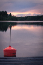 A buoy in front of a dramatic sky