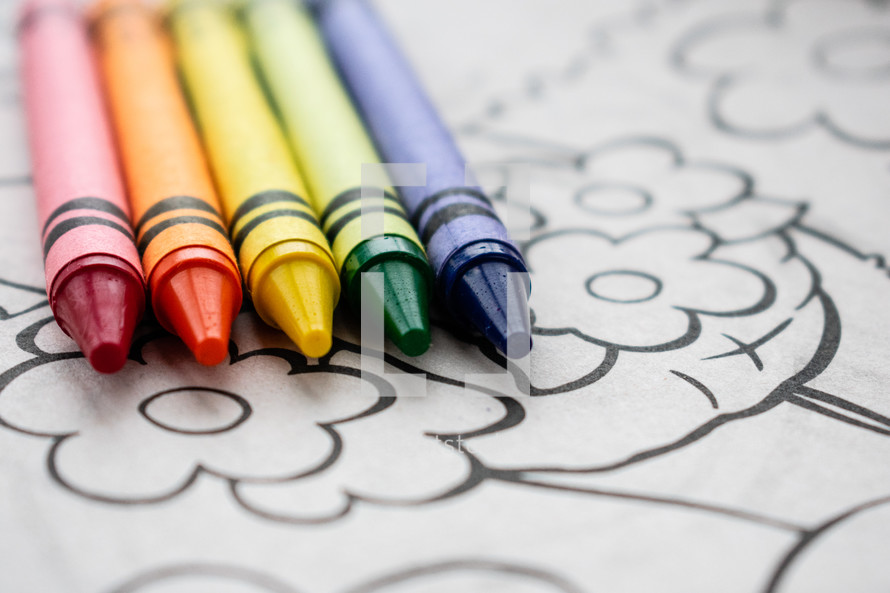 crayons on a coloring sheet 