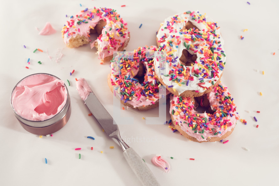 sprinkled donuts with pink icing 