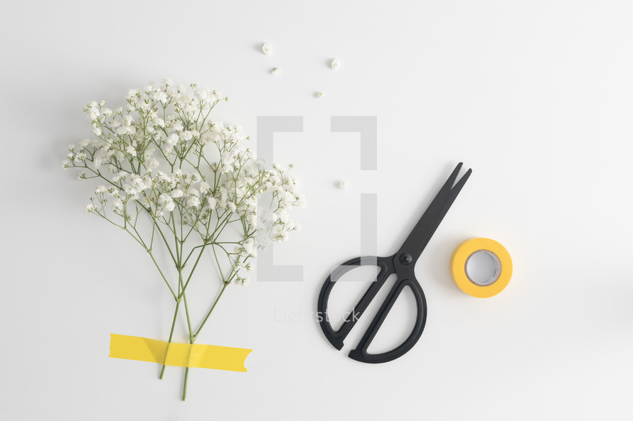 flowers, tape, and scissors 