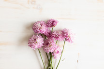 Bouquet of simple purple flowers on a white table
