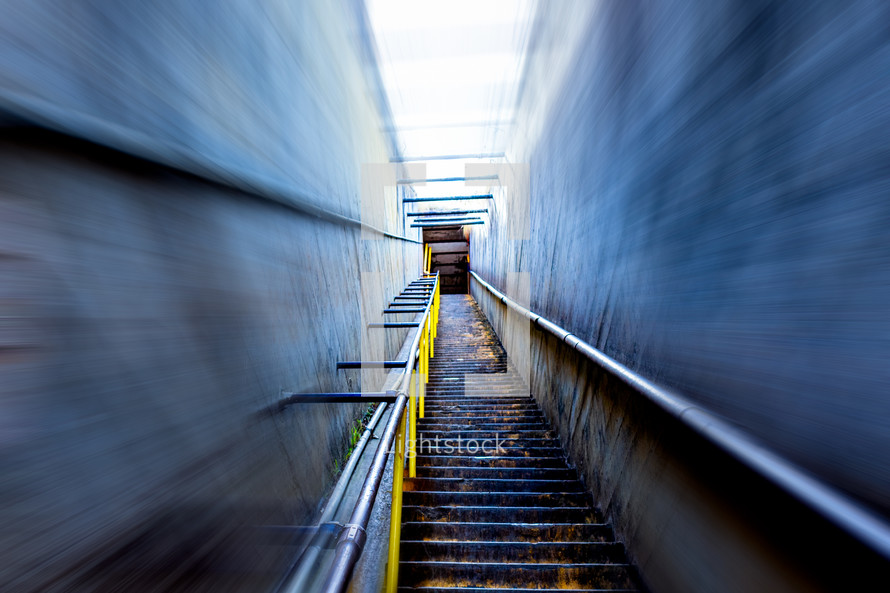 Stairway ascent into unknown with motion blur