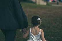 father walking with his daughter 
