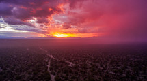 Aerial sunset after a storm in the desert
