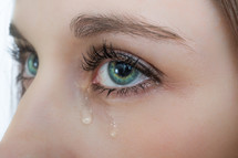 tears in a woman's eyes