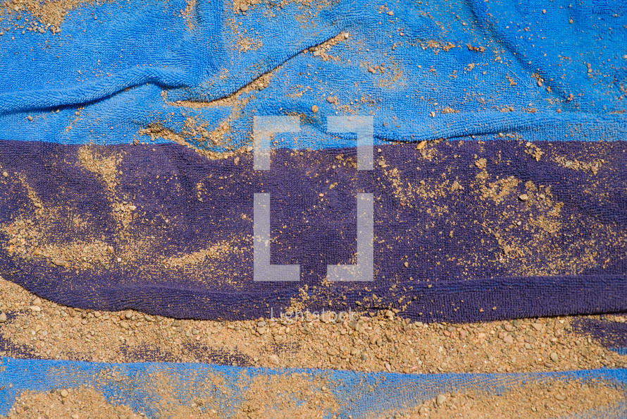 sand on a beach towel 