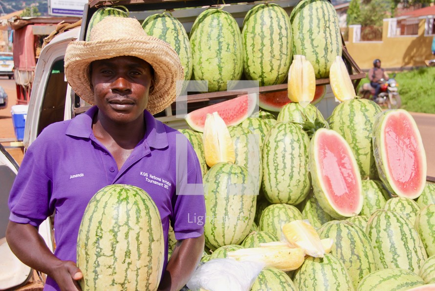 a man selling watermelons 