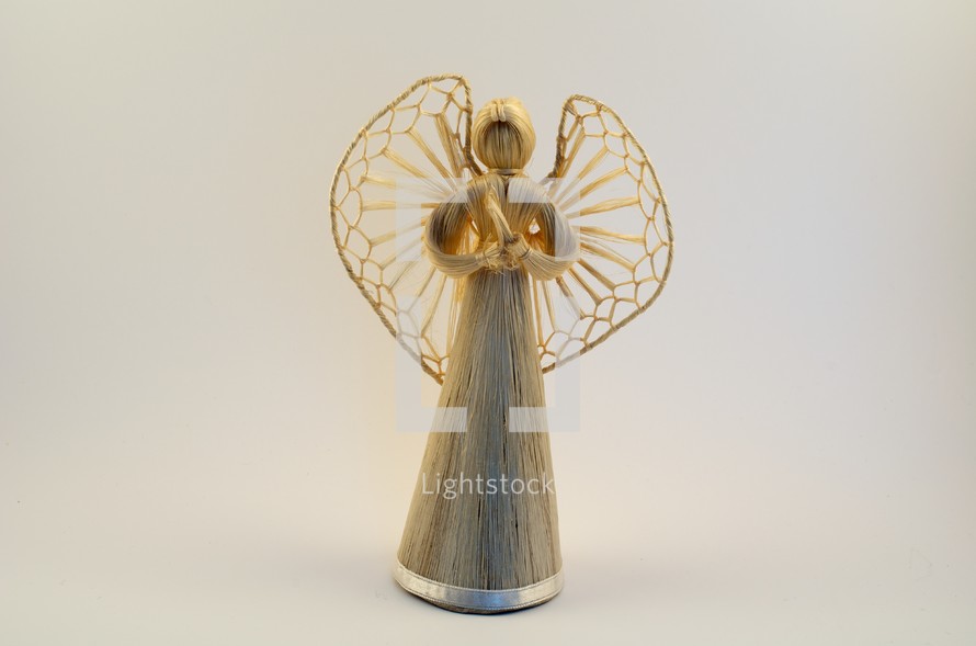 A straw angel figurine. 