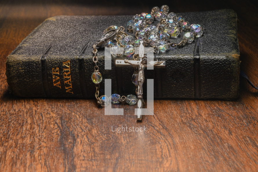 Rosary on a faith book 