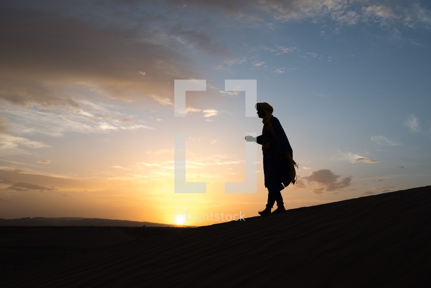 silhouette of a man in a desert 