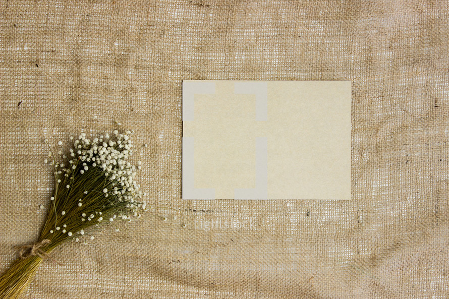 bouquet of flowers, stationary, an envelope on linen 