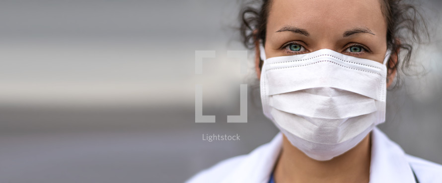 female doctor in a surgical mask 