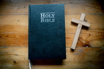 Bible with Cross is placed on a wooden table on Sunday. worship prayer and bible study concept.