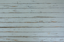 horizonal wood boards with peeling paint 