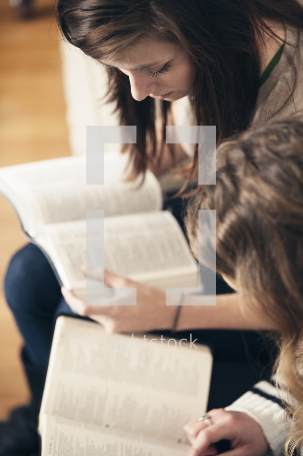 Friends reading the Bible together.