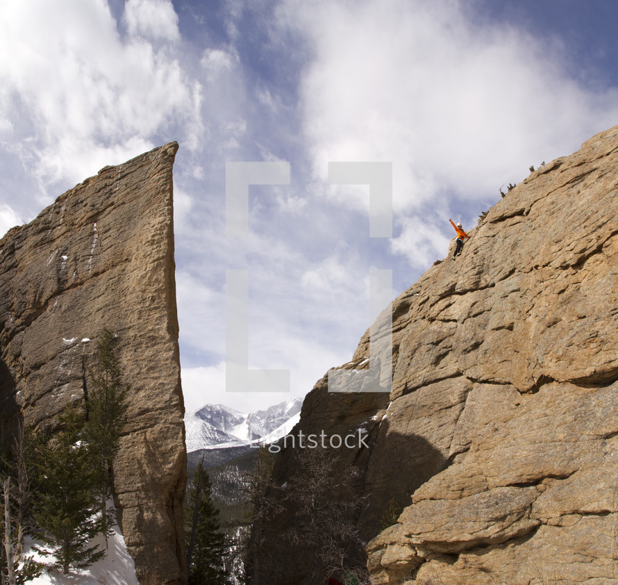 rock climbing a steep cliff 