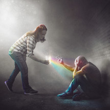 A woman gives a man a cup of water. It turns into a colorful prism.