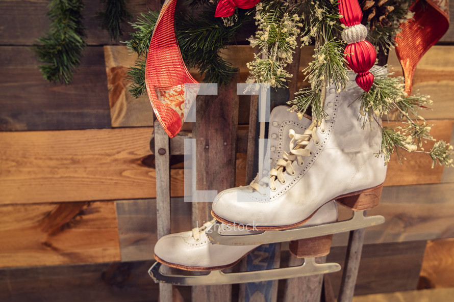 Christmas decorations with skates, pine branches, ribbon and ornaments