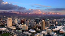 Aerial view of salt lake city skyline sunset view glow Salt Lake City skyline 4k Drone shot with the Wasatch Mountain in the background	
