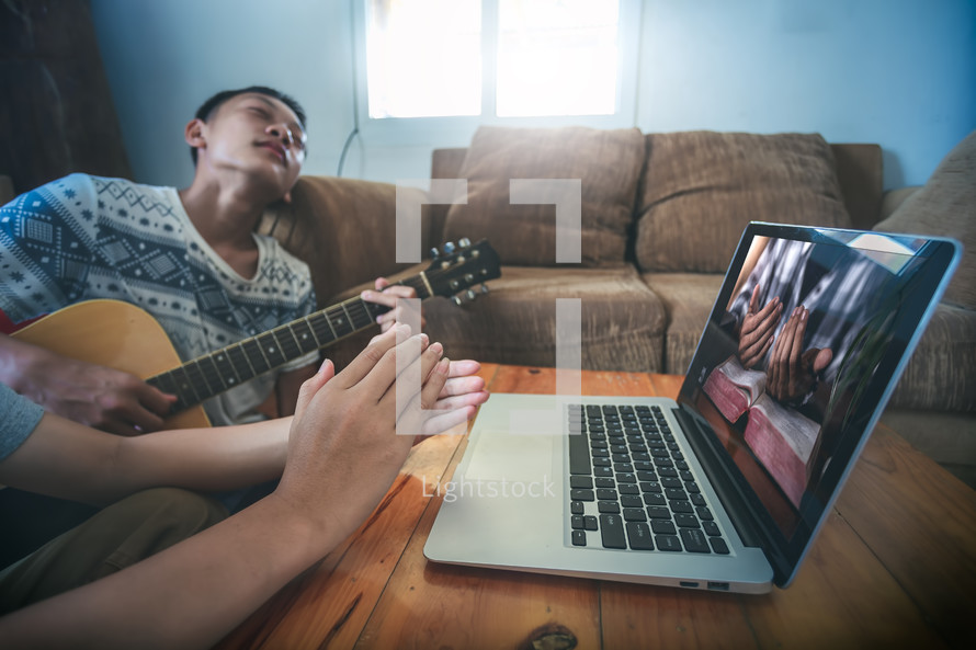boys singing and praying online with others 