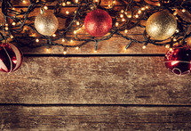Christmas frame decorations with balls and lights, empty space for text