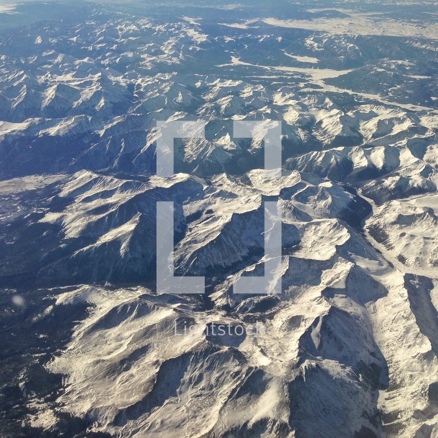 aerial view of snow covered mountain peaks