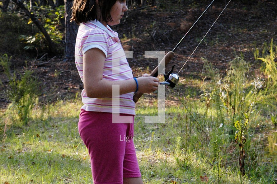 a girl with a fishing pole 