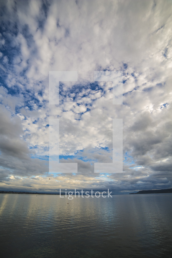 clouds in a blue sky over the lake 