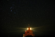 lighthouse and the night sky