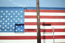 American flag painted on a brick wall 