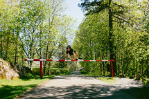 a man jumping over a gate 