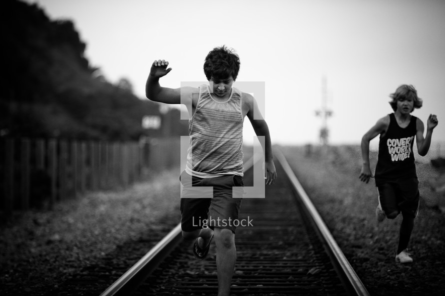 boys running on the tracks