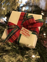 Happy Birthday Jesus gift tag on handmade ornament on Christmas tree