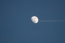 An airplane flying in front of the moon 