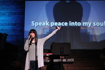 worship leader leading a congregation in song 