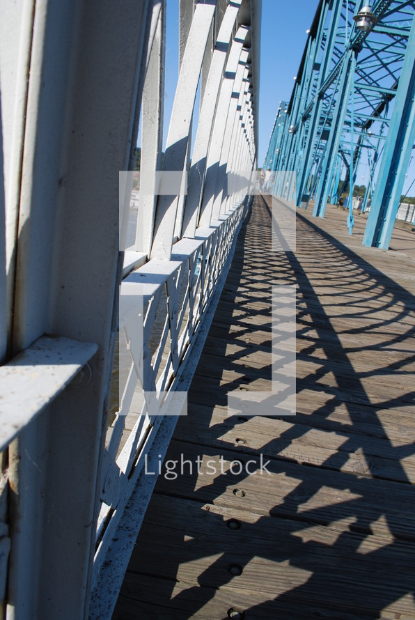 shadows from bridge railings 