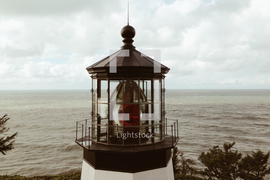 A lighthouse overlooking the ocean.