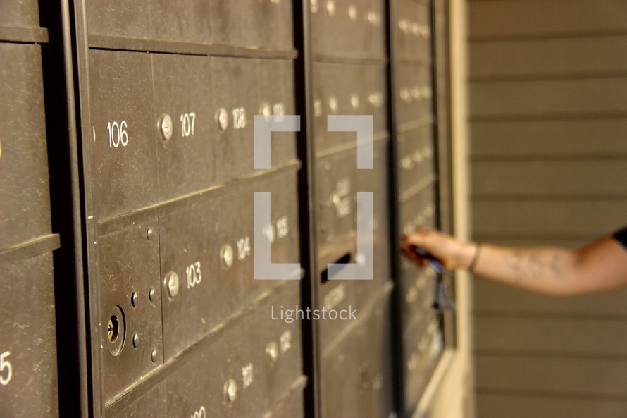 a woman checking her mail 
