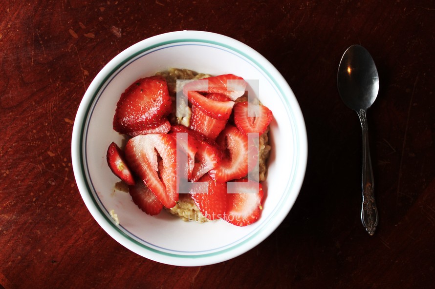 bowl of strawberries and cereal 