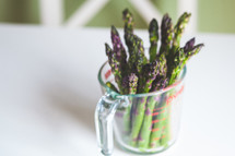 asparagus in a measuring cup 