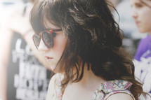 head shot of a teen girl in sunglasses 