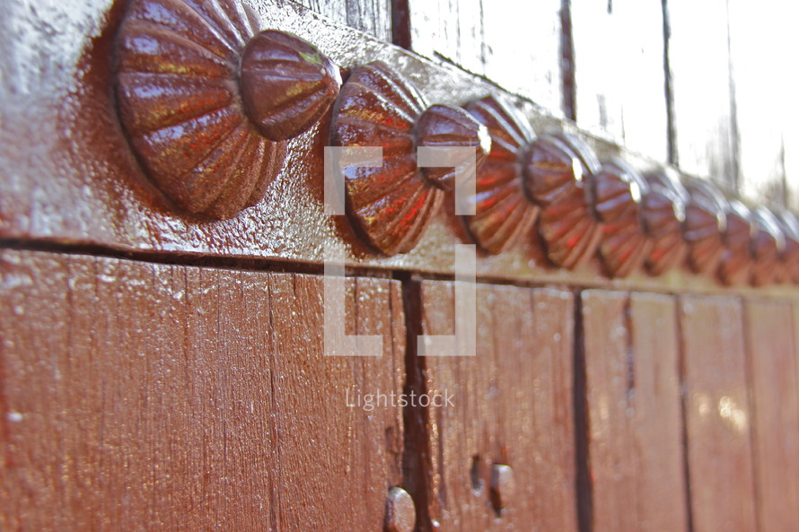 decorative metal buttons on a door in India 