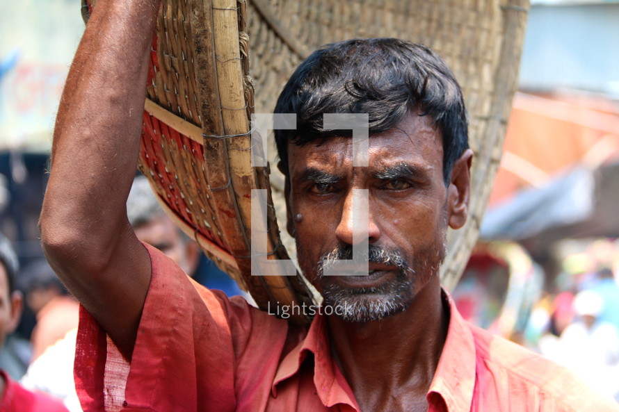 Hindu lower cast 'basket man' in a local market 