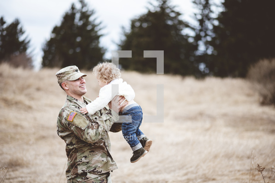 military father with his infant son 