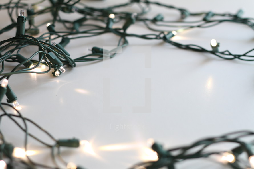 string of lights on a white background 